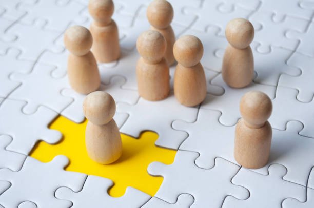 A wooden doll filled the missing jigsaw puzzle. Hiring and employment concept.